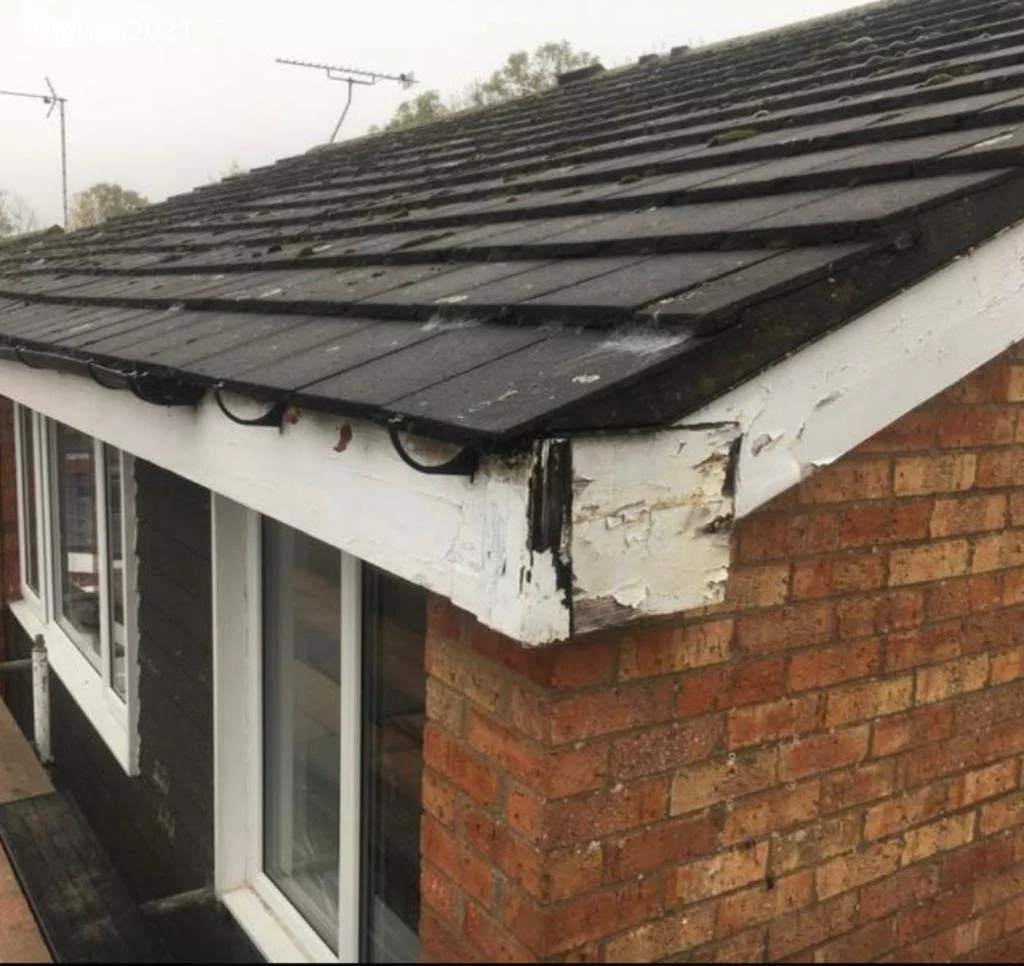 Rotten timber fascia and bargeboard before replacement