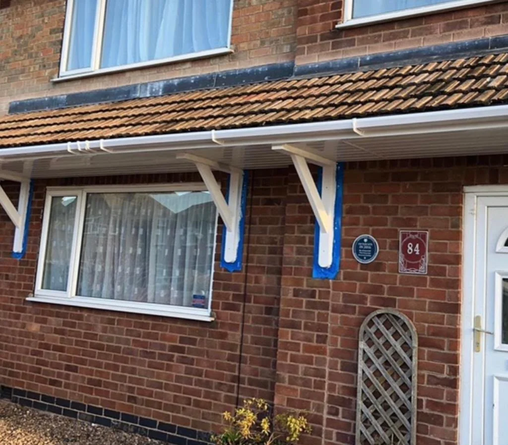 Re-tiled porch canopy with new fascia and guttering