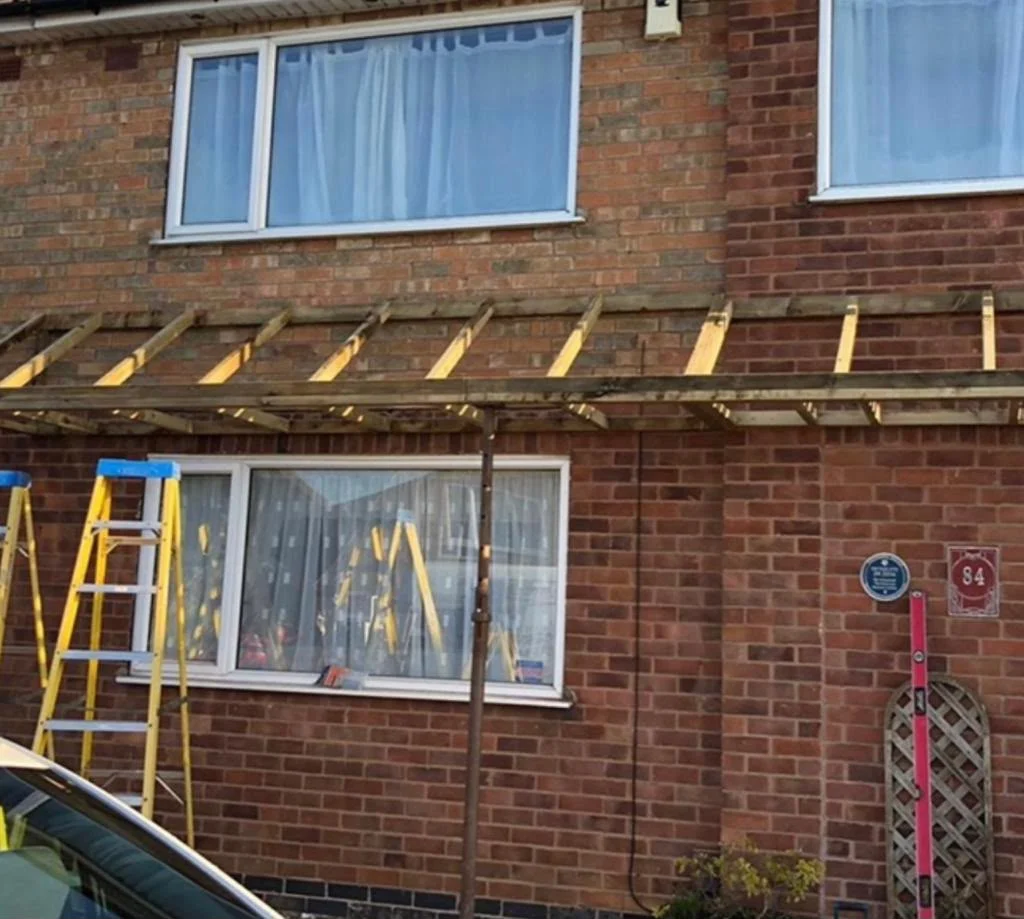 Porch canopy stripped back to new timber battens