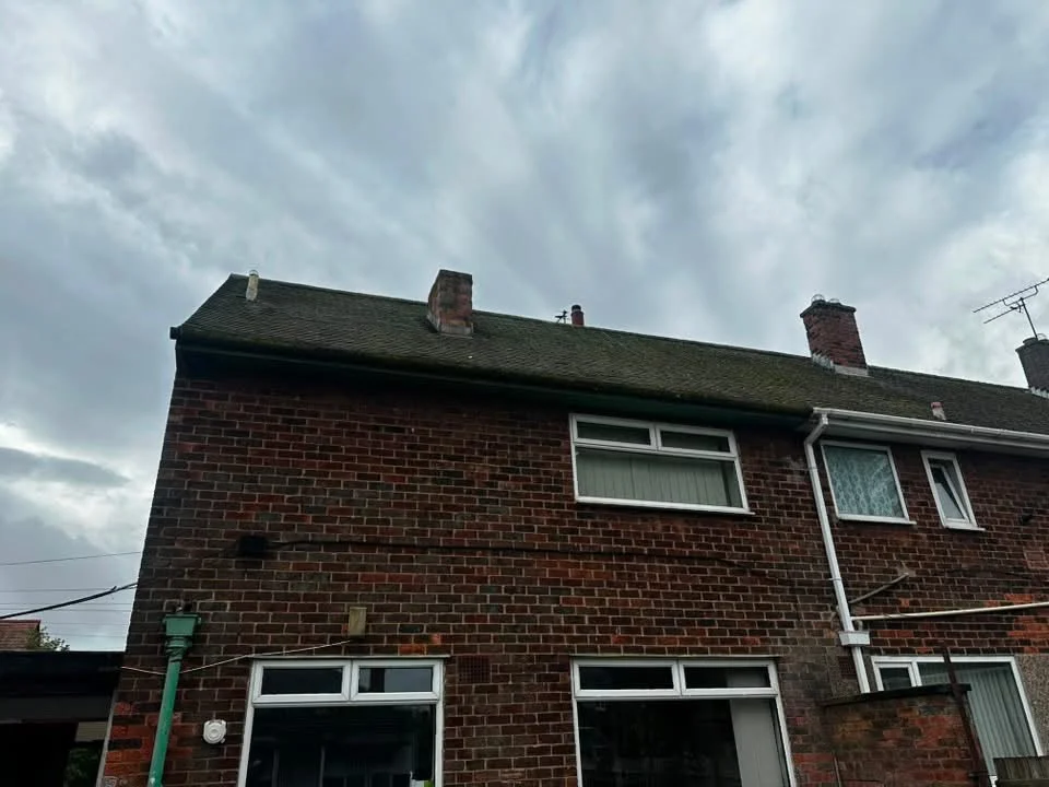 Mossy roof and old roofline before work