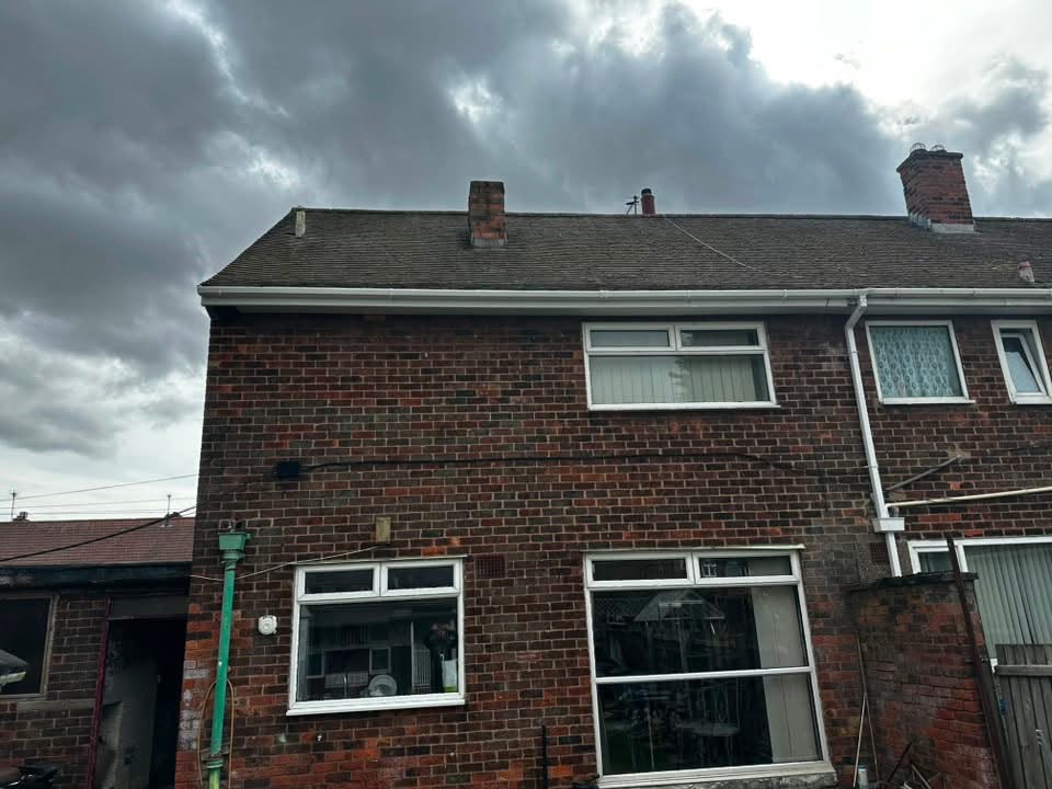 Cleaned roof with new white fascias and guttering