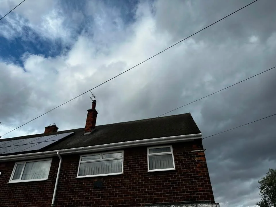 New white UPVC fascias and guttering on a semi-detached house