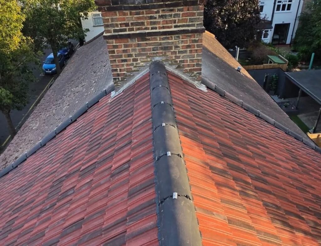 New red concrete tile roof with dry-fix ridge and chimney flashing
