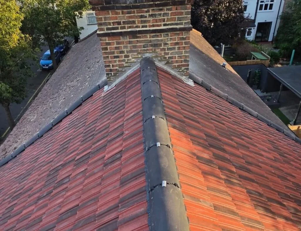 New red concrete tile roof with dry-fix ridge and chimney flashing