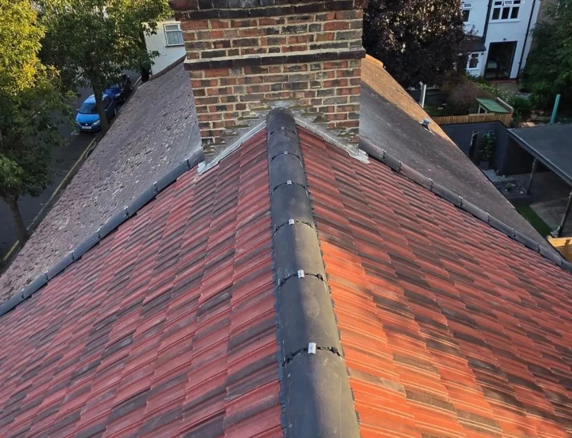 New red concrete tile roof with dry-fix ridge and chimney flashing