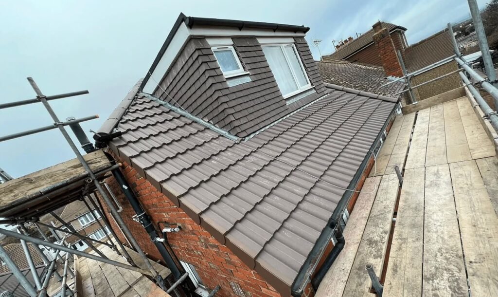 Newly tiled dormer and roof slope with lead flashing