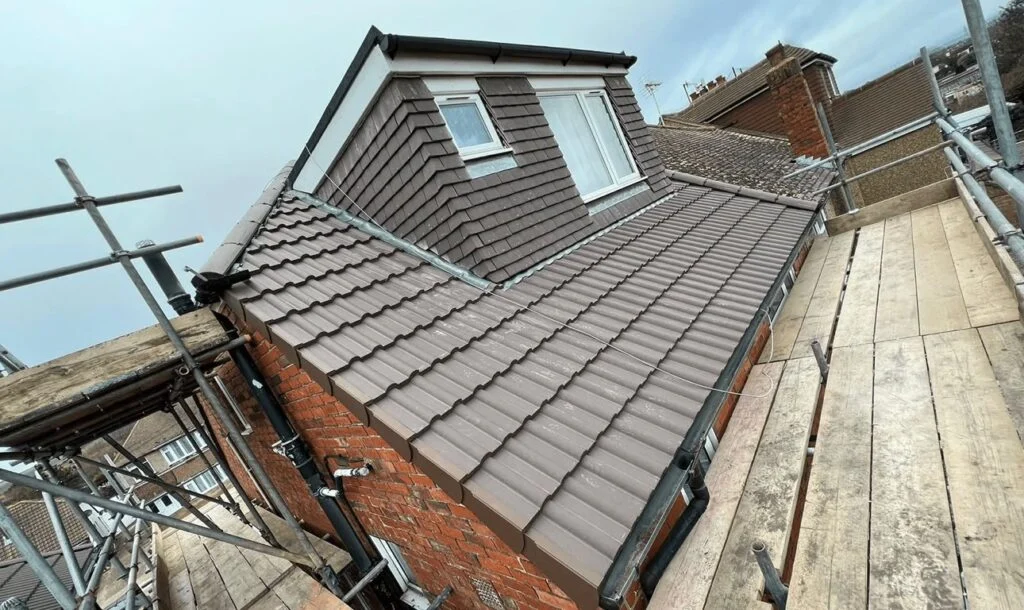 Newly tiled dormer and roof slope with lead flashing