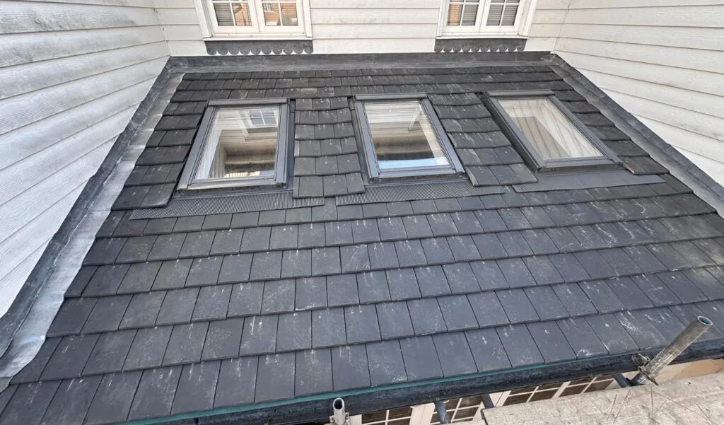 Slate roof with three new roof windows fitted and flashed