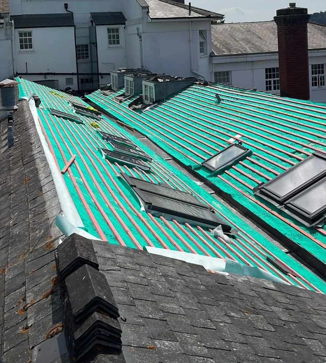 Large re-roofing project with new membrane, battens and roof windows going in